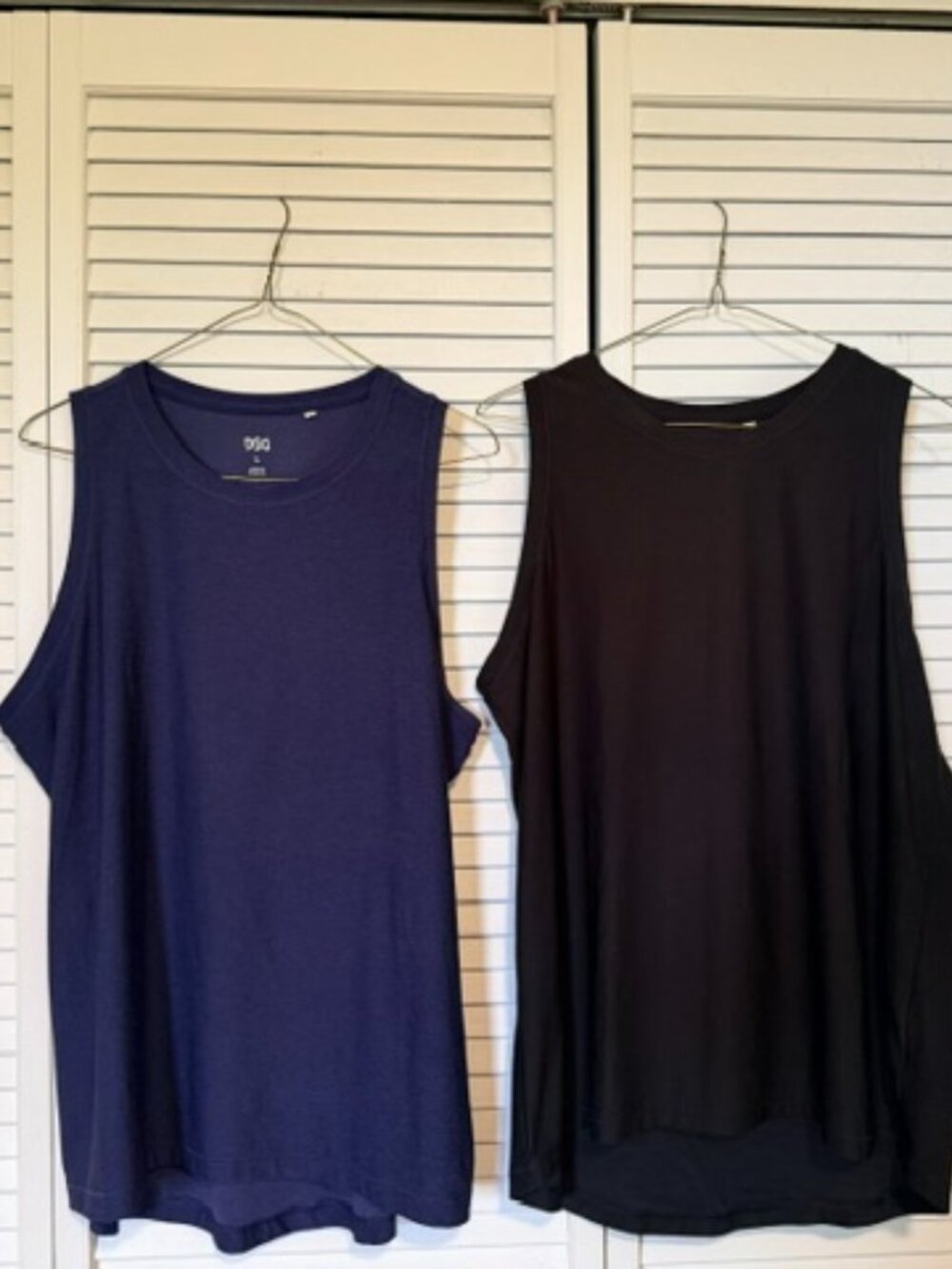 Two DSG sleeveless workout/running shirts - Size Large